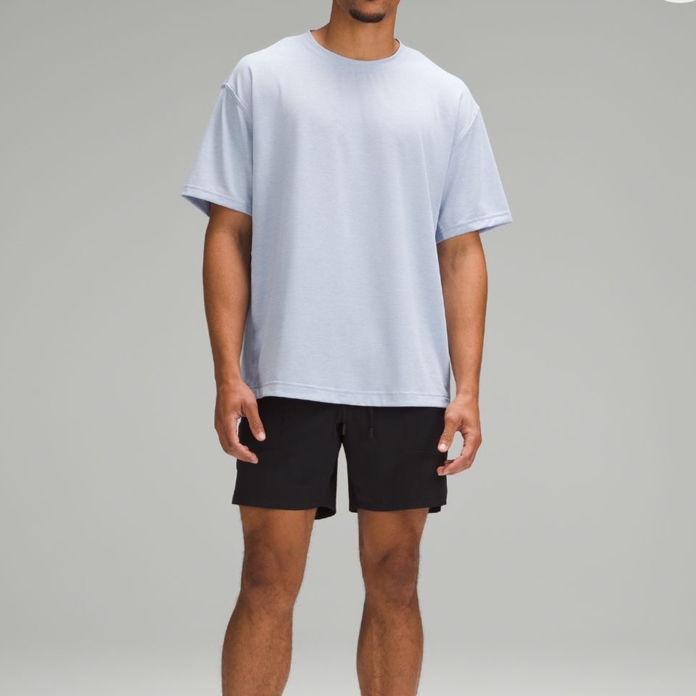 LULULEMON MENS BLACK LICENSE TO TRAIN LINERLESS SHORT 7”